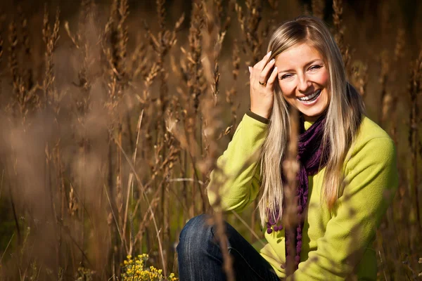 Caucasian young adult blond woman outdoor fall time Stock Picture