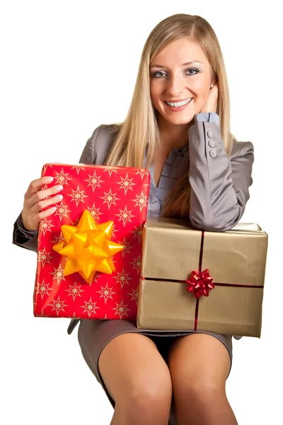 Blond caucasian woman in formal dress with gift boxes isolated on white — Stock Photo, Image