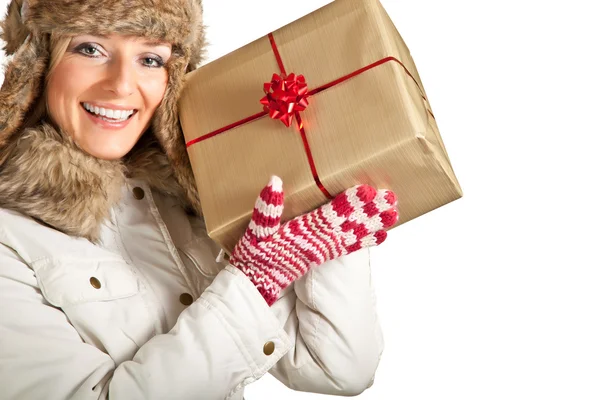 Caucasian blond woman in furry hat and christmas gifts isolated on white — Stock Photo, Image