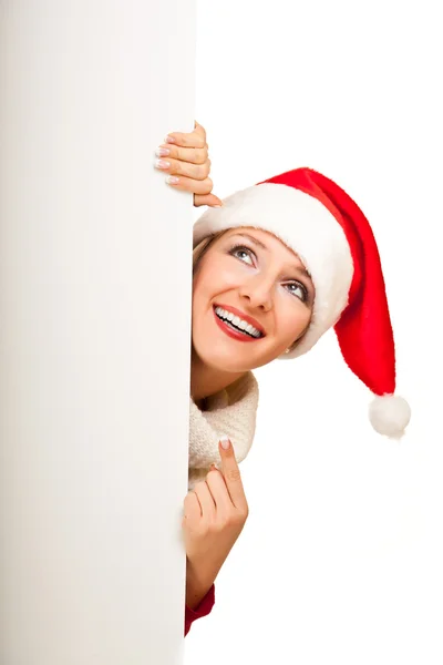 クリスマス サンタ帽子の女プレゼントします。 — ストック写真