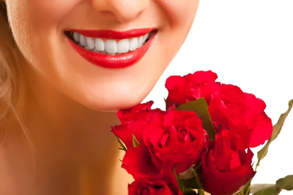 Beautiful caucasian woman with red roses on white isolated backg Stock Image