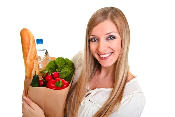Žena, která nosí pytel s potravinami izolovaných na bílém — Stock fotografie