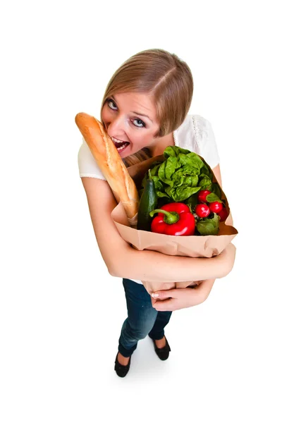 Žena, která nosí pytel s potravinami izolovaných na bílém — Stock fotografie
