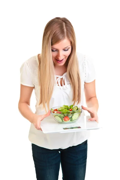 Woman with salad and scales isolated on white — Stock Photo, Image