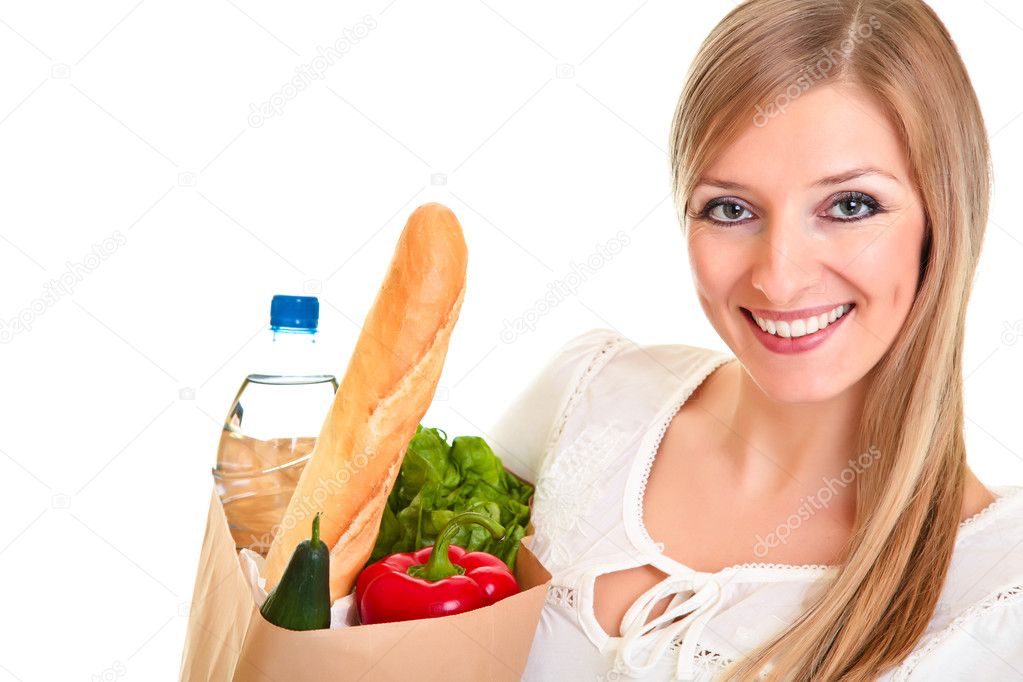 Woman carrying bag of groceries isolated on white