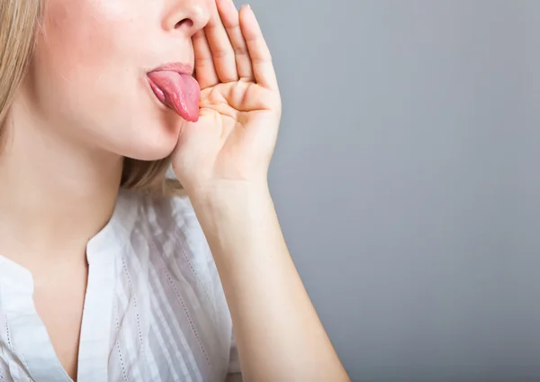 Woman shows tongue — Stock Photo, Image