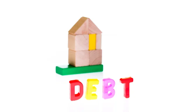 Koncepce dluhů a úvěrů od hračka bloky — Stock fotografie