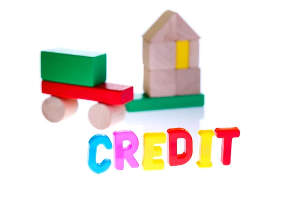 Концепция долга и кредита от игрушечных блоков — стоковое фото