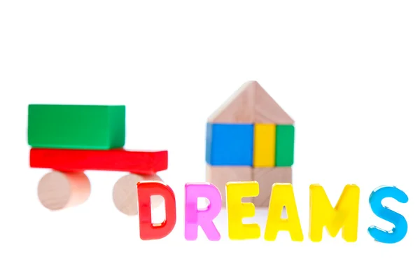 夢は、おもちゃのブロックからの家族との生活の概念 — ストック写真