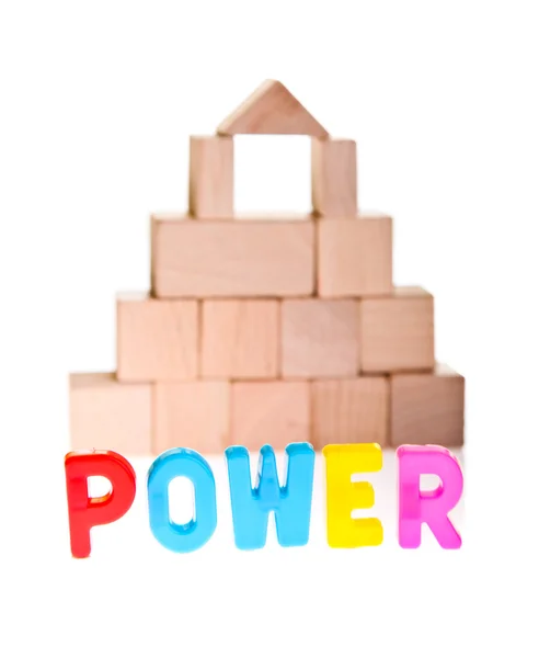 Power käsite puinen lelu lohkot — kuvapankkivalokuva