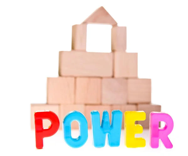 Power concept from wooden toy blocks — Stock Photo, Image