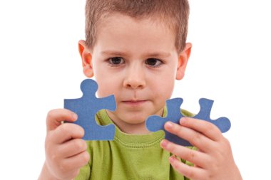 Boy with puzzles clipart