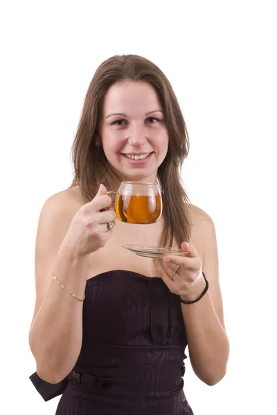 Nainen likaantumassa teetä — kuvapankkivalokuva
