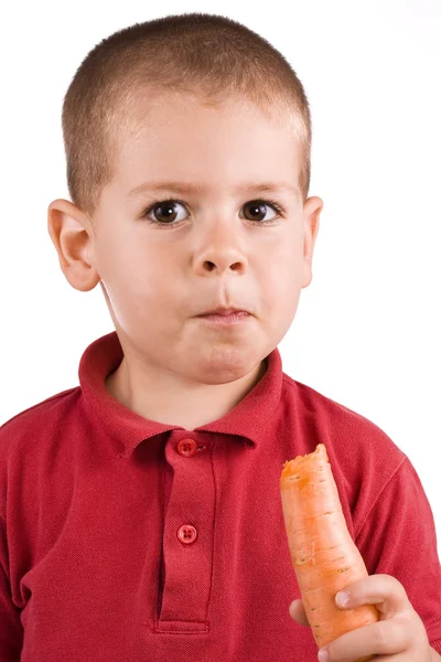 Niño y zanahoria — Foto de Stock