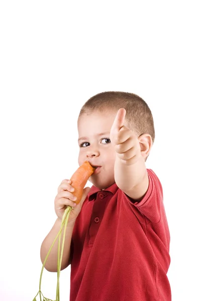 Niño y zanahoria —  Fotos de Stock