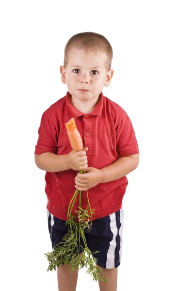 Хлопчик і морква — стокове фото