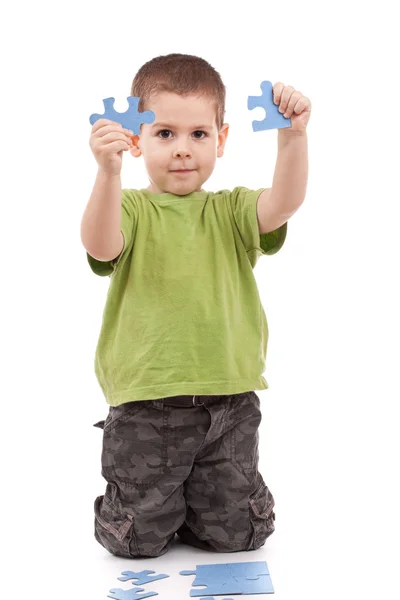 Boy with puzzles Stock Photo