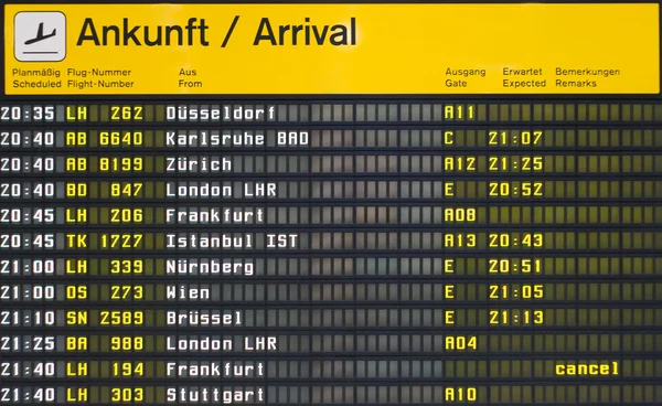 Arrival board at an airport — Stock Photo, Image