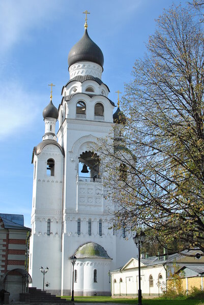Russian Orthodox high bell tower of white stone