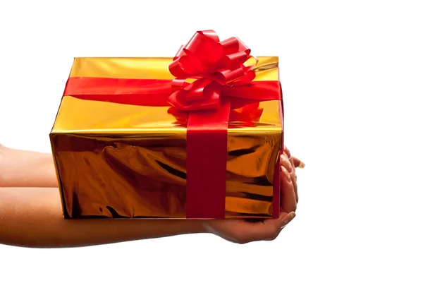 Gold gift box in woman's hand — Stock Photo, Image