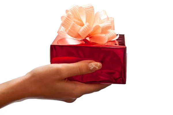 Red present in woman's hand — Stock Photo, Image