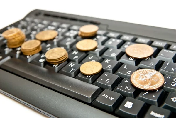 Coins on keyboard — Stock Photo, Image