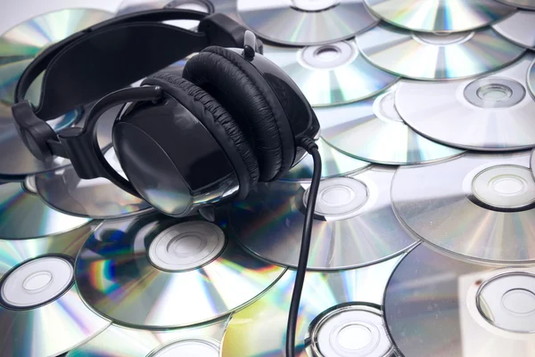 CDs background and headphones — Stock Photo, Image