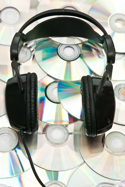 DVD zázemí a sluchátka — Stock fotografie