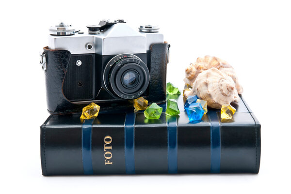 Vintage camera and photo album. Isolated on white