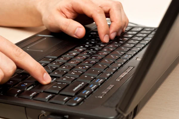 Hands on laptop keyboard — Stock Photo, Image