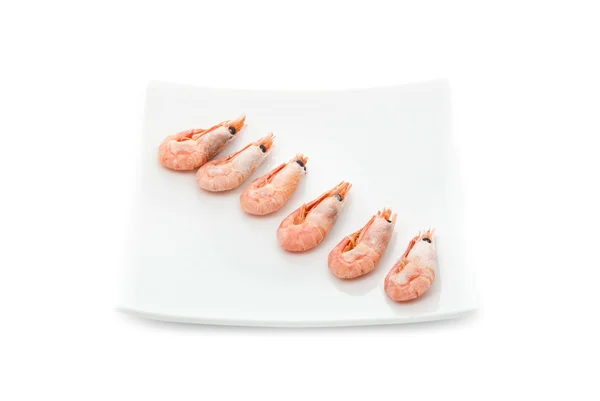 Row from prawns on plate — Stock Photo, Image
