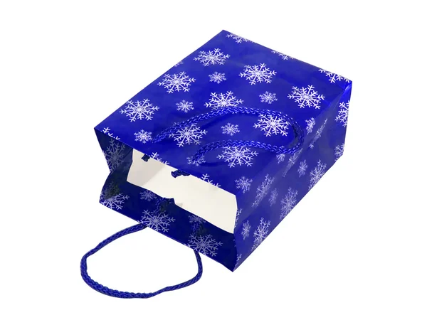 Sac en papier bleu avec flocons de neige — Photo