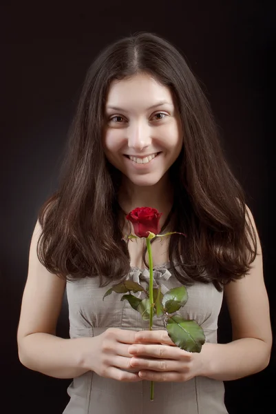 Flicka med en ros — Stockfoto
