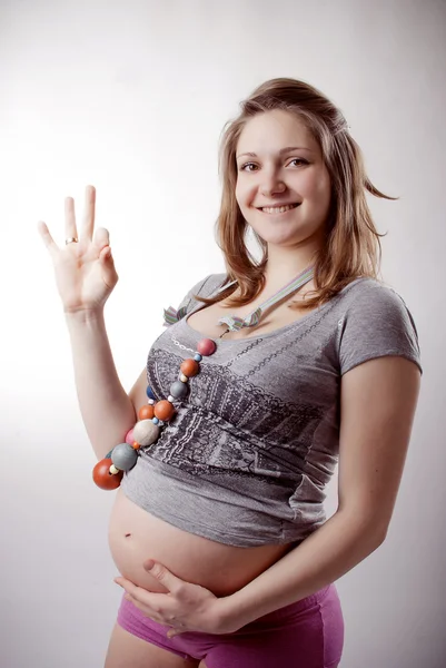 Legrační těhotná žena — Stock fotografie