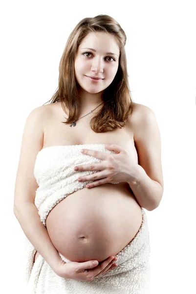 Pregnant woman in a white fur — Stock Photo, Image