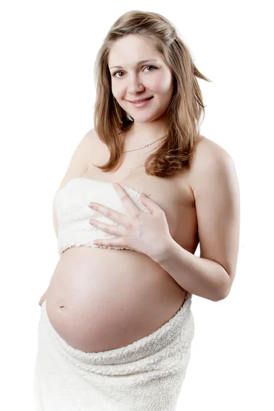Těhotná žena v bílém kožichu — Stock fotografie