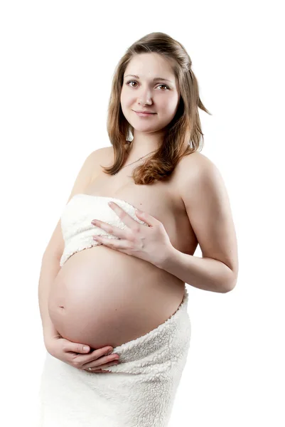Pregnant woman in a white fur — Stock Photo, Image