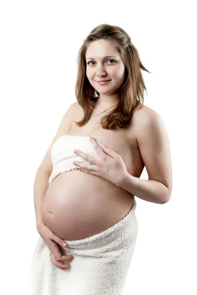 Těhotná žena v bílém kožichu — Stock fotografie
