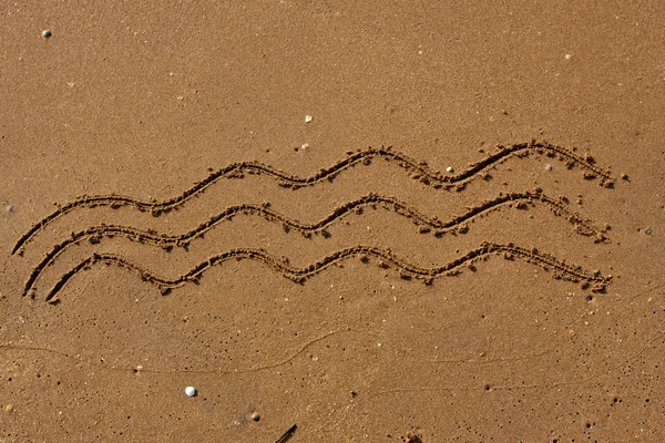 Хвилі на піску . — стокове фото