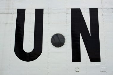 The United Nations sign on the board of the aircraft clipart