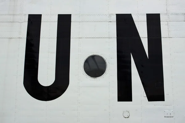 stock image The United Nations sign on the board of the aircraft