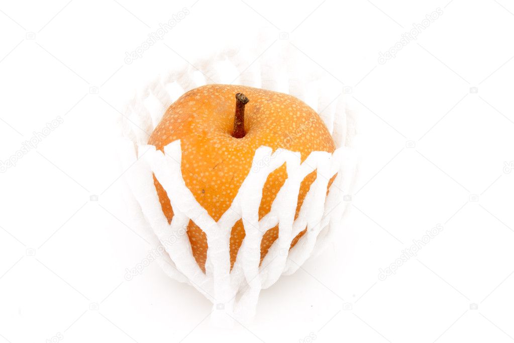 Food Industries - Fruits - Nashi pear wrapped in white protection net - Isolated on white background.