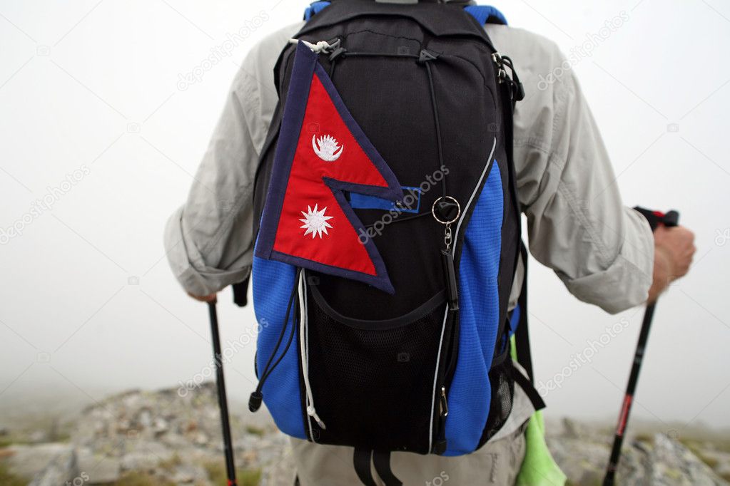 Mountaineer with Nepal flag