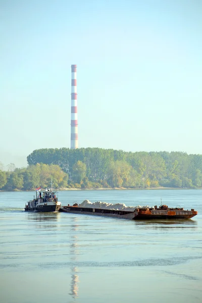 Cargo ship and heating plant at the Danube — Stock Photo, Image