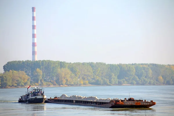 Cargo ship and heating plant at the Danube — Stock Photo, Image