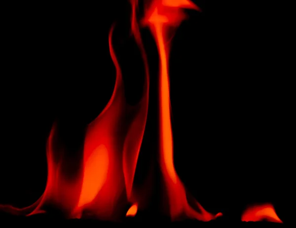 Bright flames on a black background — Stock Photo, Image