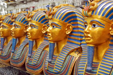 A number of statues of pharaohs in the gift shop clipart