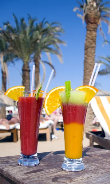 stock image Cocktails from fresh fruit in a tall glass with tubes