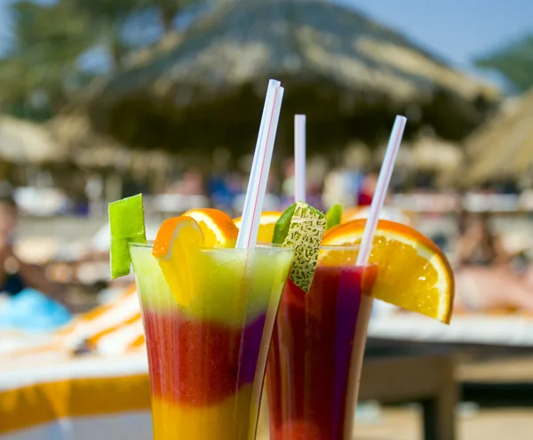 Stock image Cocktails from fresh fruit in a tall glass with tubes