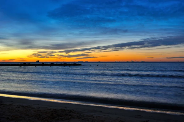 stock image Spain, coast of Alicante sunrise with ship